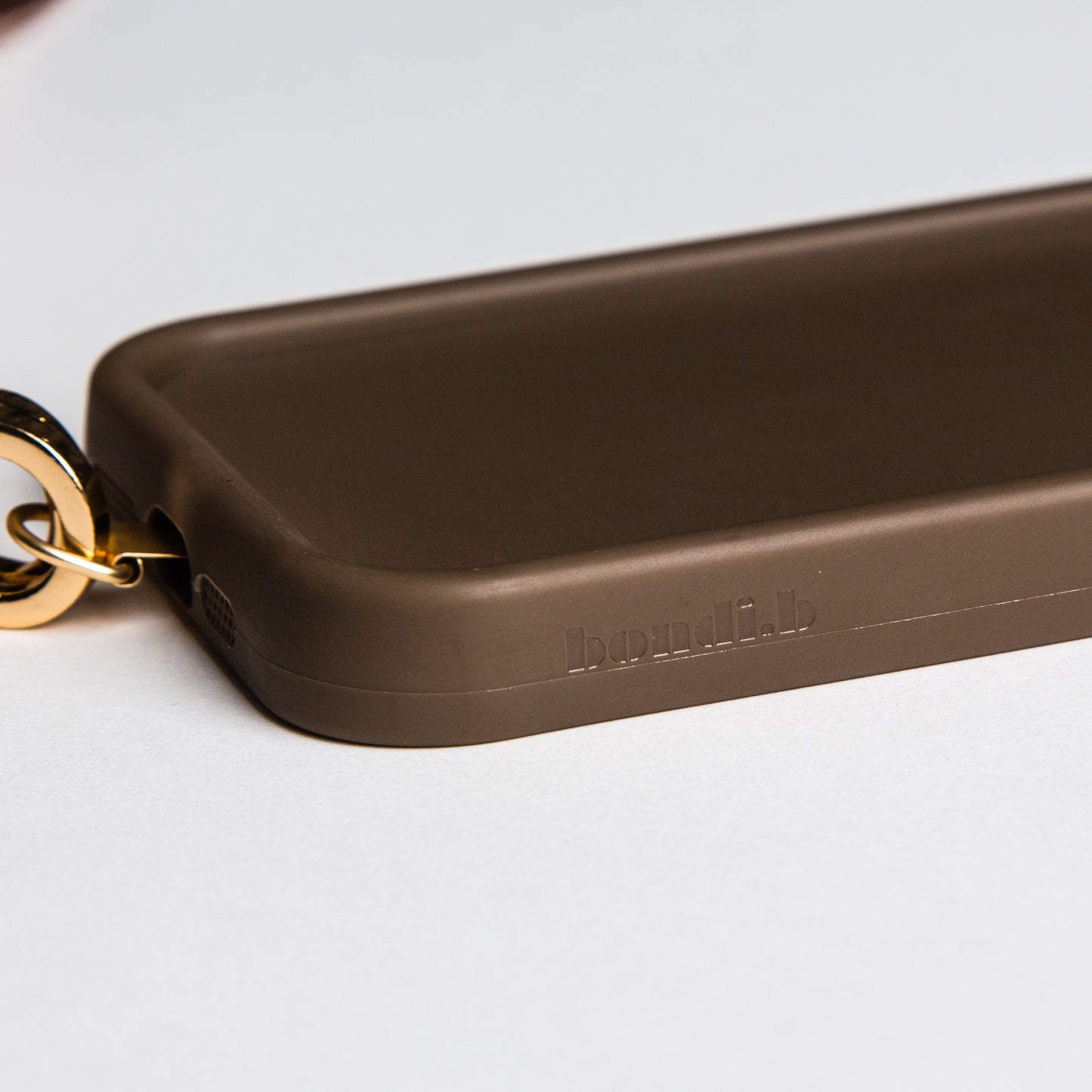 Stylish crossbody phone case with an aqua blue colour adjustable strap, designed for convenience and hands-free use. Features a secure chocolate colour phone case holder and has a sleek design making it perfect for everyday minimalist wear.