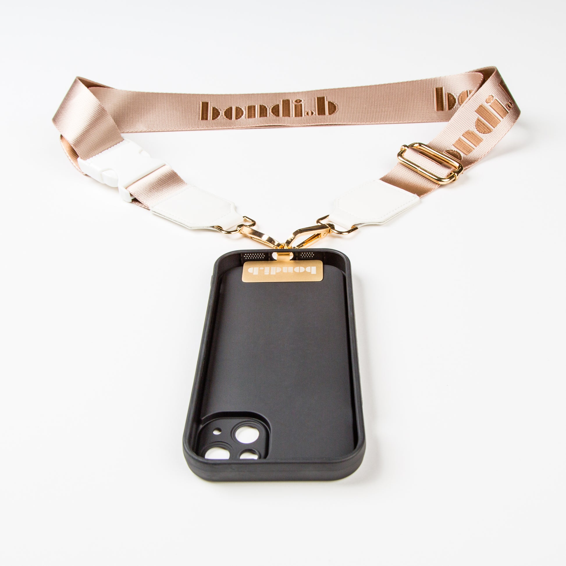 Stylish crossbody phone case with nude colour adjustable strap, designed for convenience and hands-free use. Features a secure black colour phone case holder and has a sleek design making it perfect for everyday minimalist wear.
