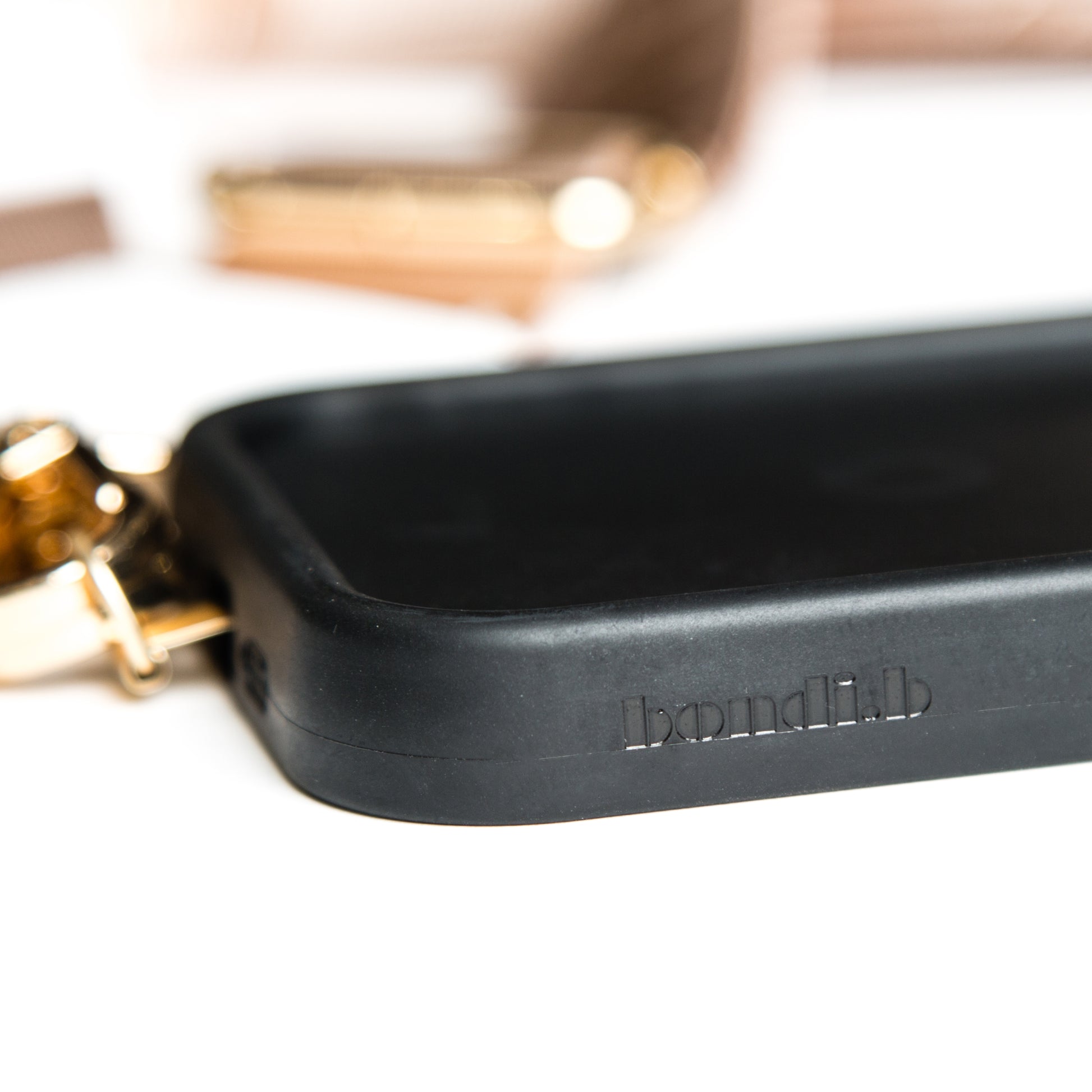 Stylish crossbody phone case with nude colour adjustable strap, designed for convenience and hands-free use. Features a secure black colour phone case holder and has a sleek design making it perfect for everyday minimalist wear.