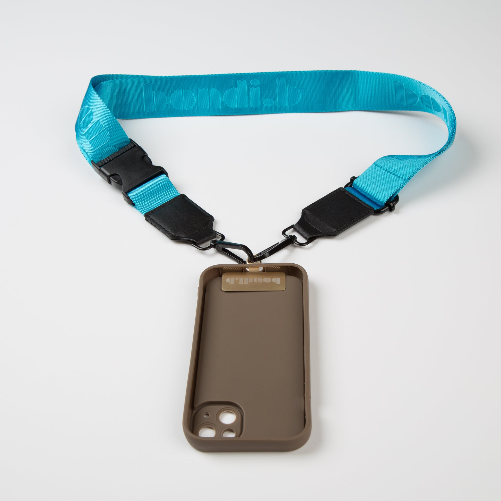 Stylish crossbody phone case with an aqua blue colour adjustable strap, designed for convenience and hands-free use. Features a secure chocolate colour phone case holder and has a sleek design making it perfect for everyday minimalist wear.